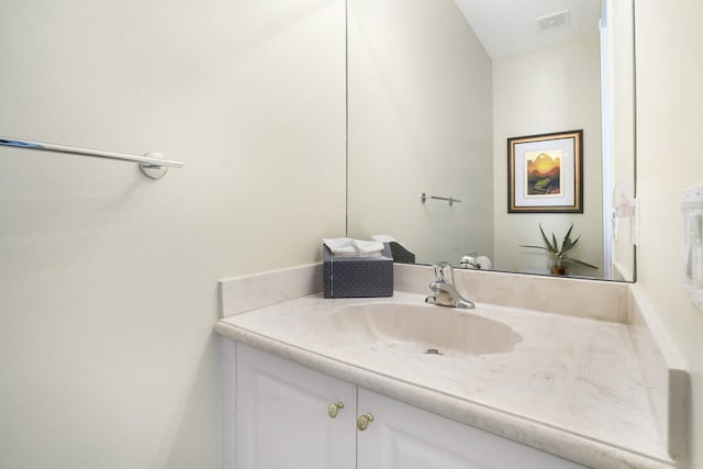 bathroom featuring vanity and visible vents