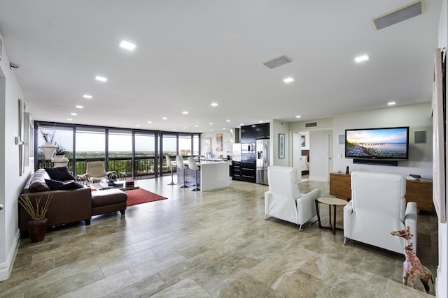 living room with a wall of windows