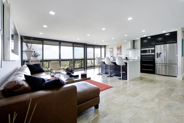 living room with floor to ceiling windows