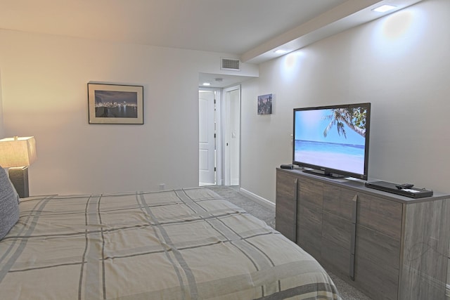 bedroom featuring light colored carpet