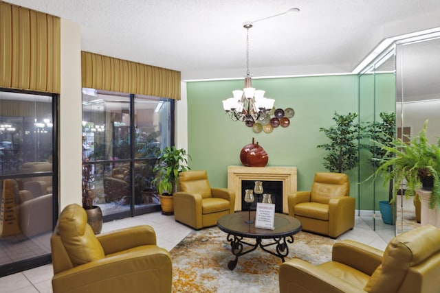 tiled living room featuring a textured ceiling and a chandelier