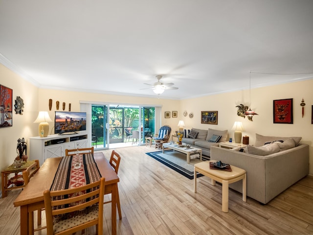 living room with ceiling fan, light hardwood / wood-style floors, and crown molding