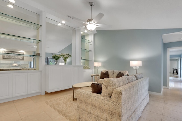 tiled living room featuring vaulted ceiling and ceiling fan