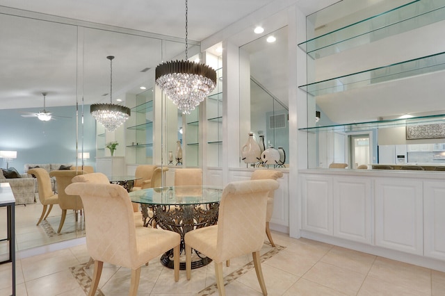 dining room with light tile patterned floors and ceiling fan with notable chandelier