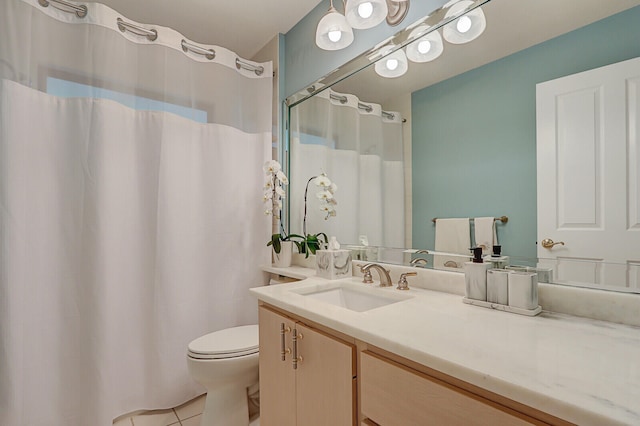 bathroom with tile patterned floors, vanity, and toilet