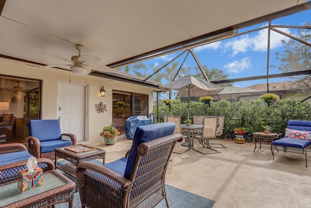 view of patio / terrace with an outdoor hangout area, area for grilling, ceiling fan, and a lanai