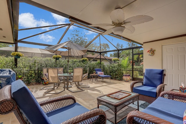 view of patio / terrace featuring glass enclosure and ceiling fan