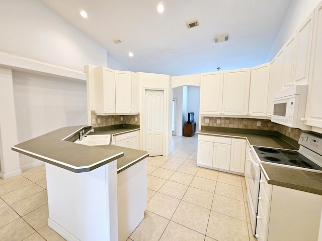 kitchen featuring decorative backsplash, white appliances, white cabinets, and sink