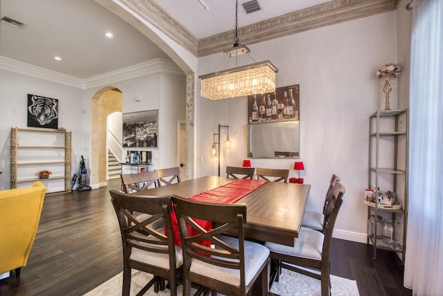 dining space with crown molding and dark wood-type flooring