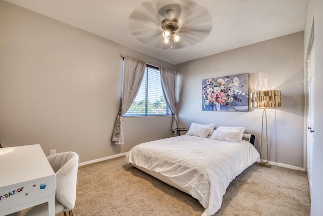 bedroom with light colored carpet and ceiling fan