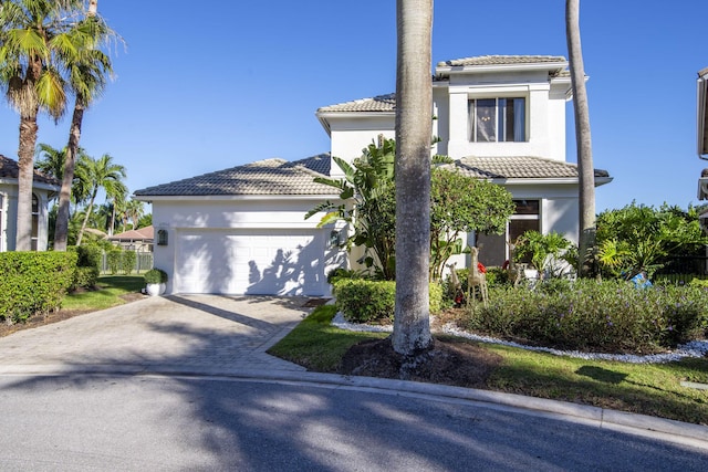 mediterranean / spanish house featuring a garage