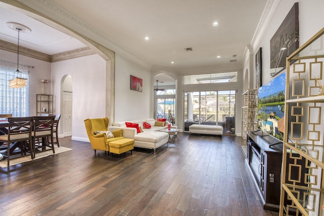 living room featuring dark wood-type flooring and ornamental molding