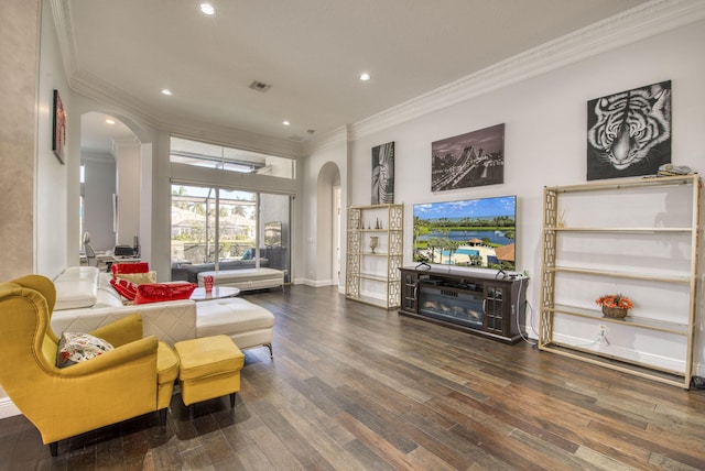 living room with ornamental molding and dark hardwood / wood-style flooring