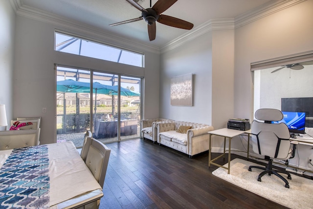 office space with dark hardwood / wood-style flooring, ornamental molding, and ceiling fan