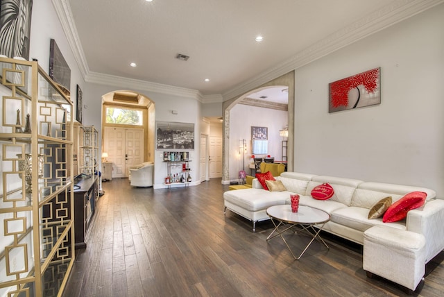 living room featuring crown molding and dark hardwood / wood-style flooring