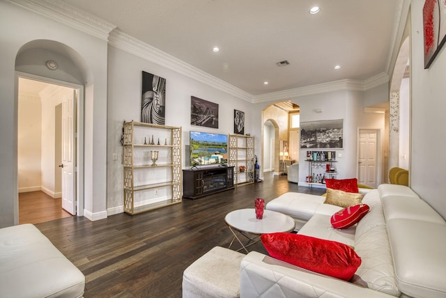 living room with ornamental molding and dark hardwood / wood-style flooring