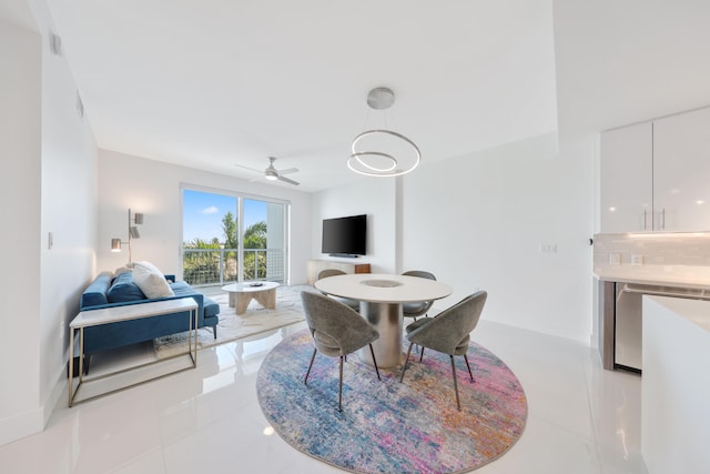 tiled dining room with ceiling fan