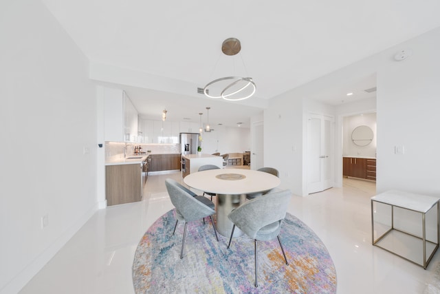 dining space featuring sink