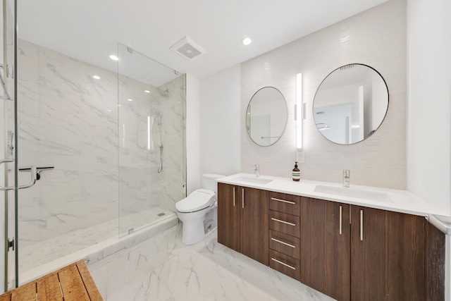 bathroom featuring an enclosed shower, vanity, and toilet