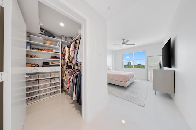 bedroom with light tile patterned floors and ceiling fan