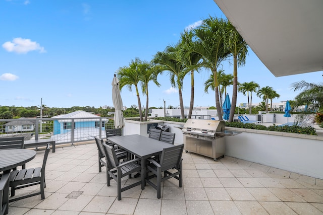 view of patio featuring a grill