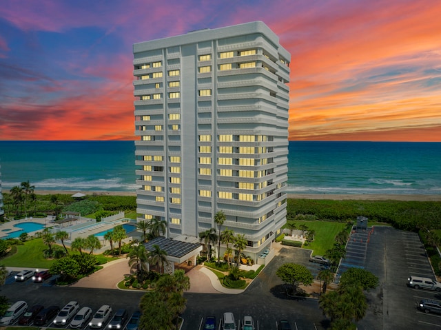 outdoor building at dusk featuring a water view