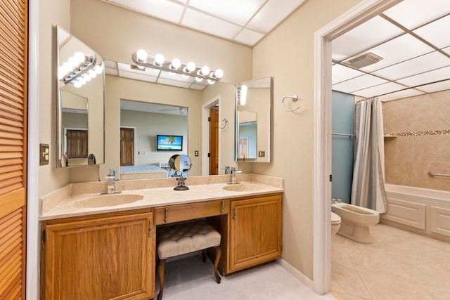 full bathroom with vanity, a bidet, tile patterned flooring, toilet, and shower / bath combo with shower curtain