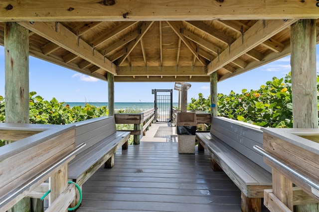 view of dock with a gazebo and a water view