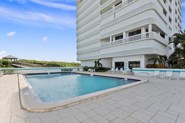 view of pool featuring a patio area