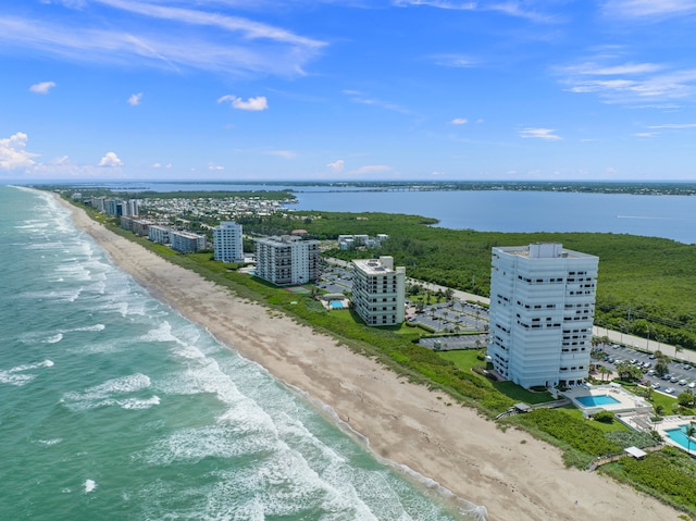 birds eye view of property featuring a water view and a view of the beach