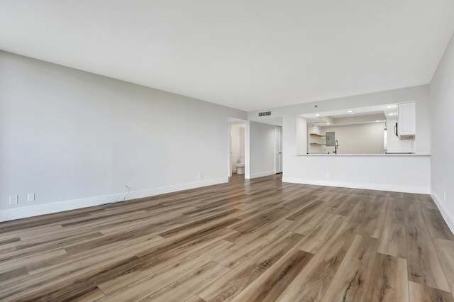 unfurnished living room featuring light wood-type flooring