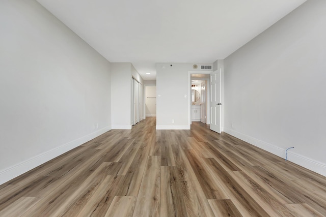 unfurnished living room with hardwood / wood-style flooring