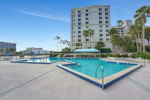 view of swimming pool featuring a patio area