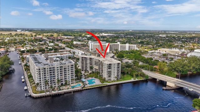 birds eye view of property with a water view