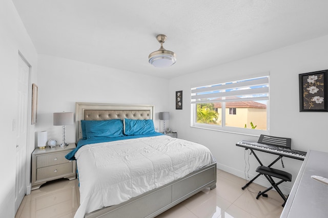 bedroom with light tile patterned flooring