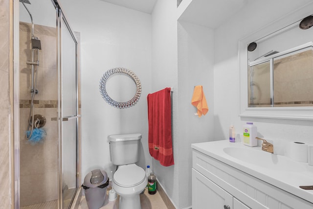 bathroom with vanity, toilet, and walk in shower