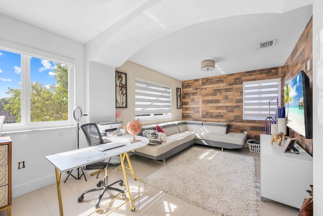 tiled living room with wooden walls