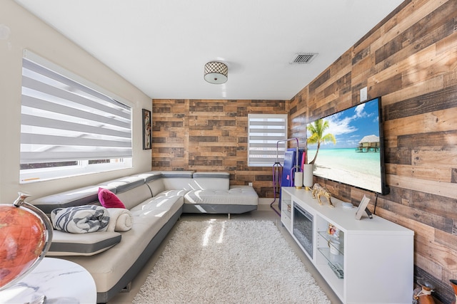 living room featuring wood walls