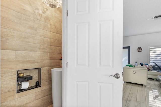 bathroom with hardwood / wood-style flooring