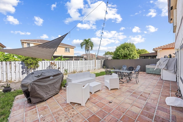 view of patio with a grill and an outdoor hangout area