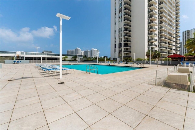 view of swimming pool with a patio