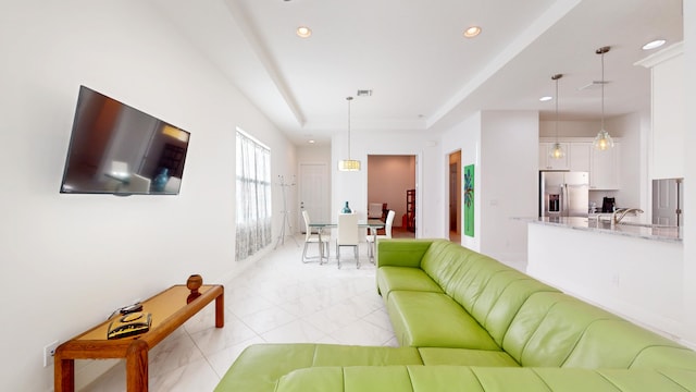 living room featuring sink