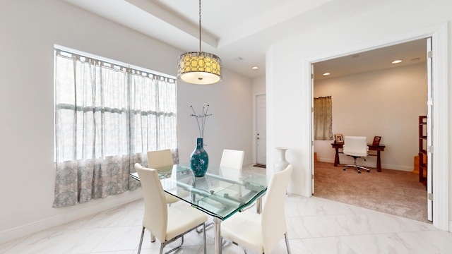 view of carpeted dining space