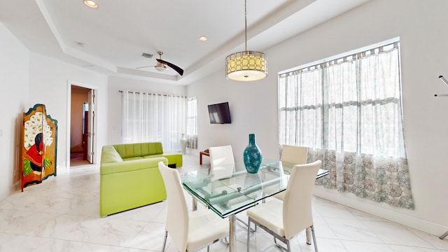 dining area with ceiling fan