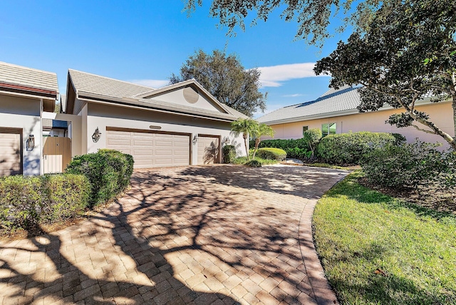 single story home featuring a garage