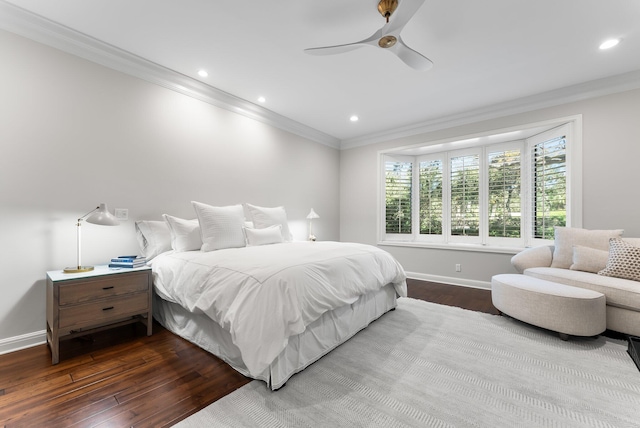 bedroom with ceiling fan, dark hardwood / wood-style flooring, and ornamental molding