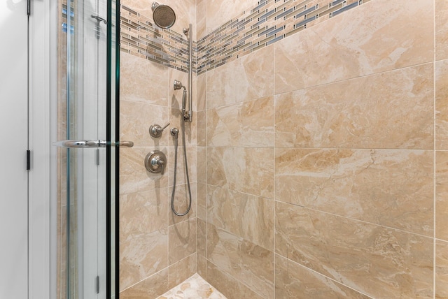 bathroom with a tile shower