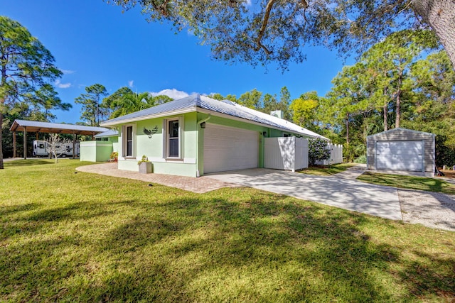 view of front of home featuring a garage and a front yard