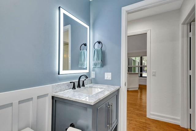 bathroom featuring hardwood / wood-style flooring and vanity