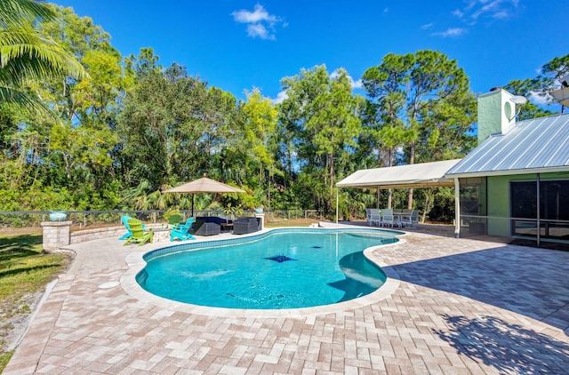 view of swimming pool featuring a patio area and an outdoor living space